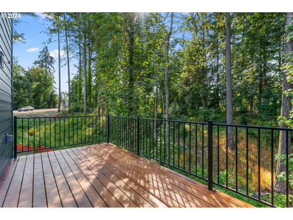a view of balcony with wooden floor