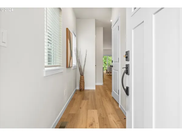 a hallway with a white wooden door