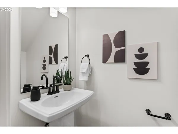 a bathroom with a sink and mirror