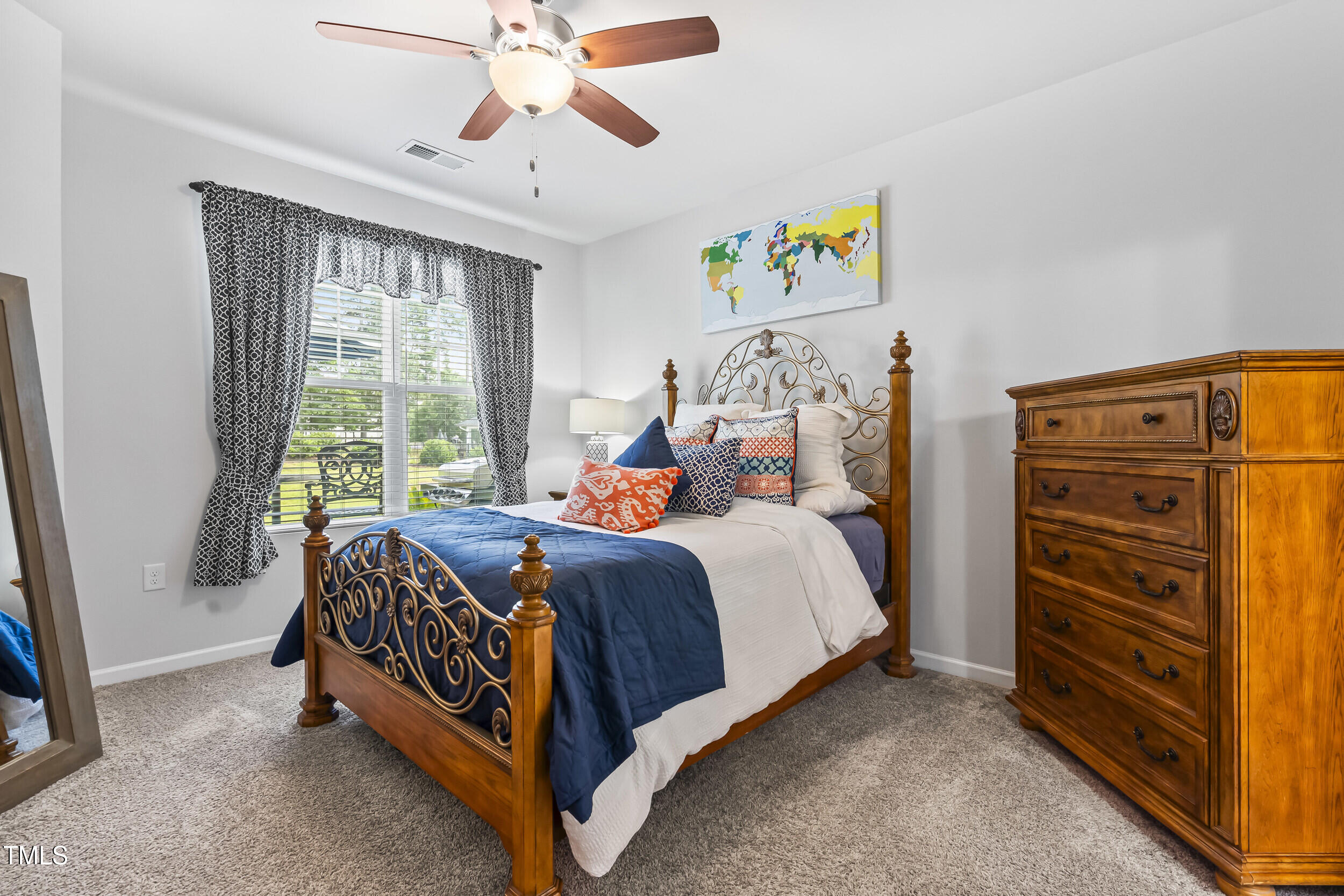 6050 Beale Loop Raleigh, NC 27616 - Photo 14 of 35 a bed room with a bed and a window