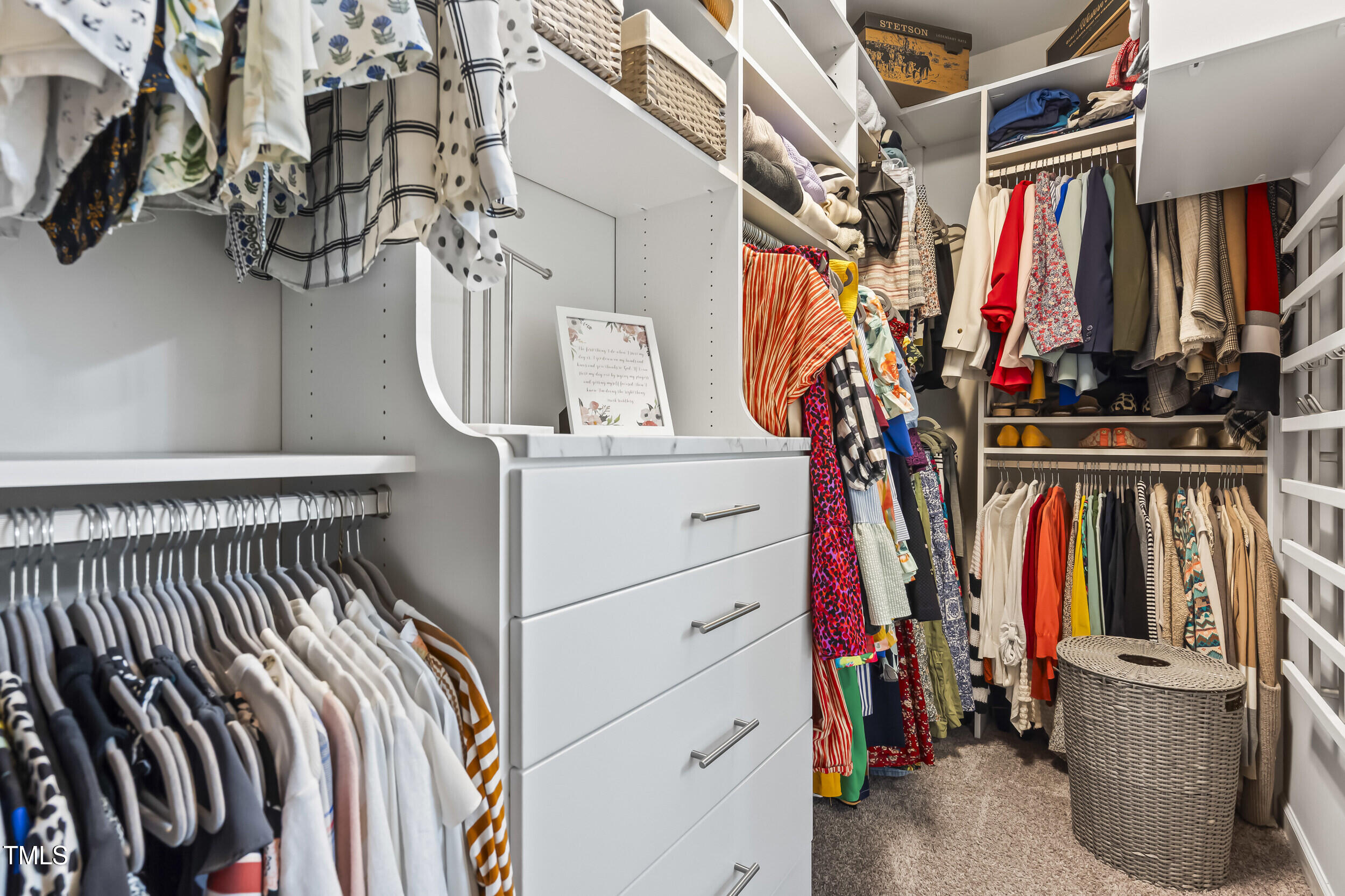 6050 Beale Loop Raleigh, NC 27616 - Photo 16 of 35 a view of walk in closet with clothes and shoes