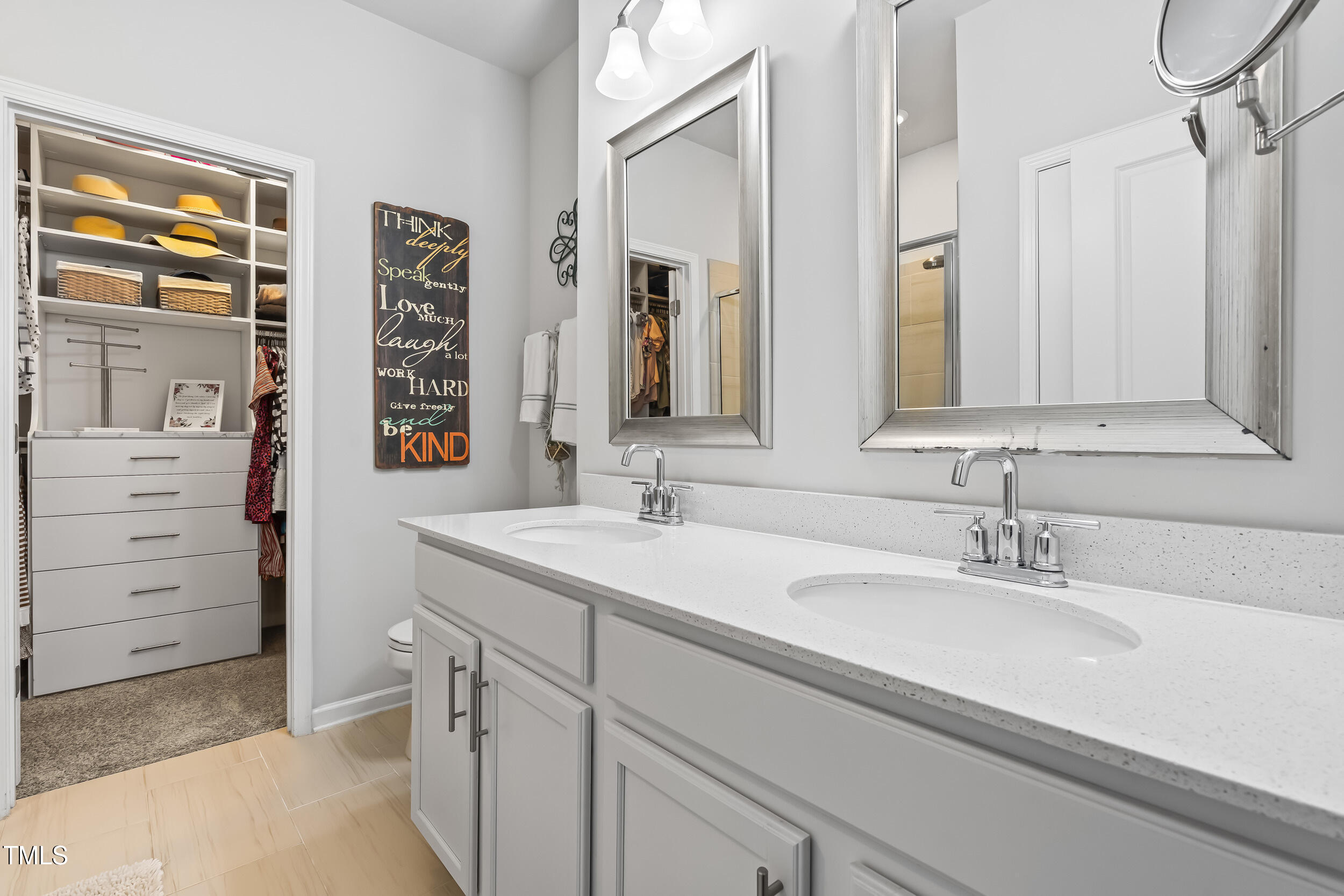 6050 Beale Loop Raleigh, NC 27616 - Photo 17 of 35 a bathroom with a sink and a mirror