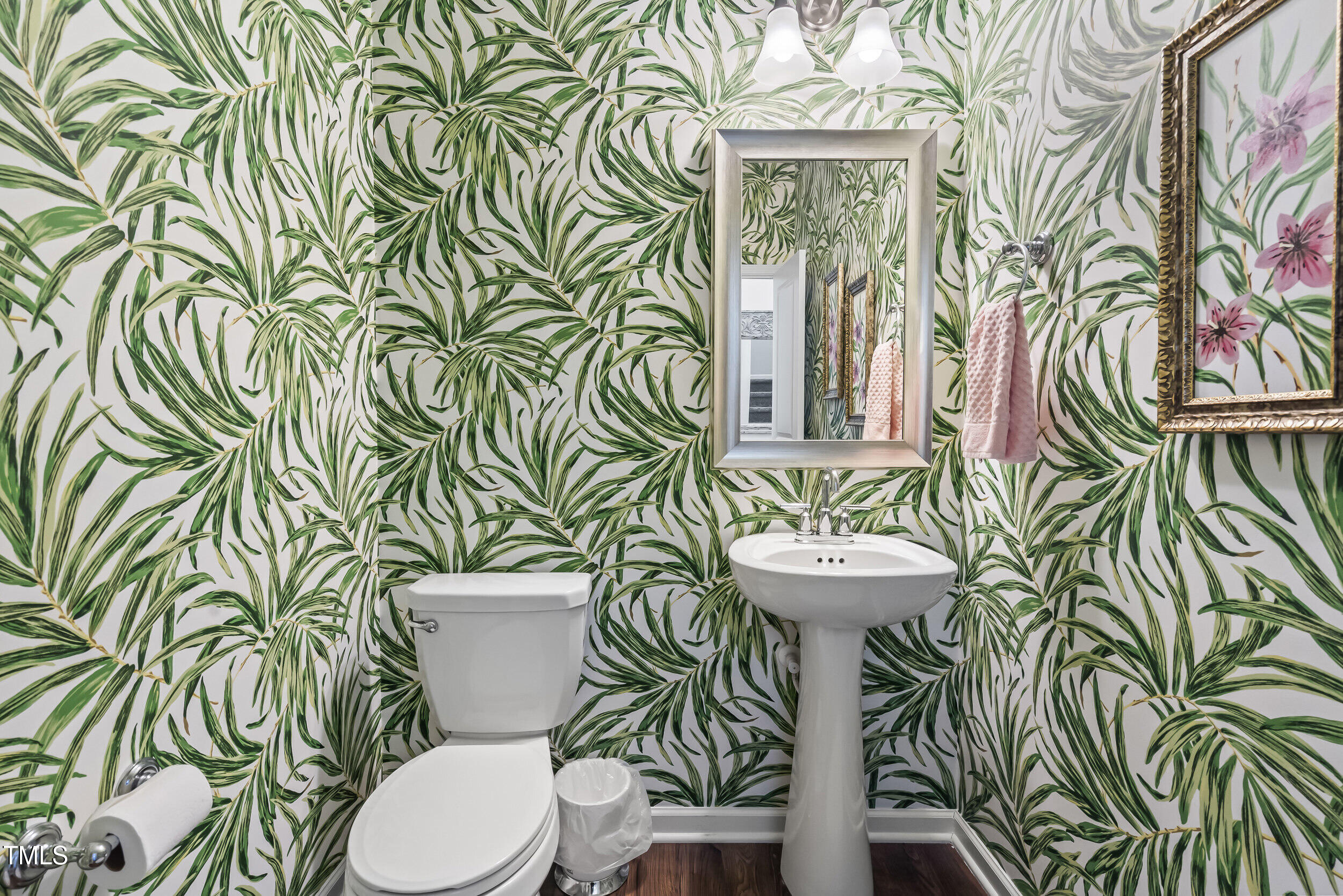 6050 Beale Loop Raleigh, NC 27616 - Photo 20 of 35 a bathroom with a toilet sink and mirror