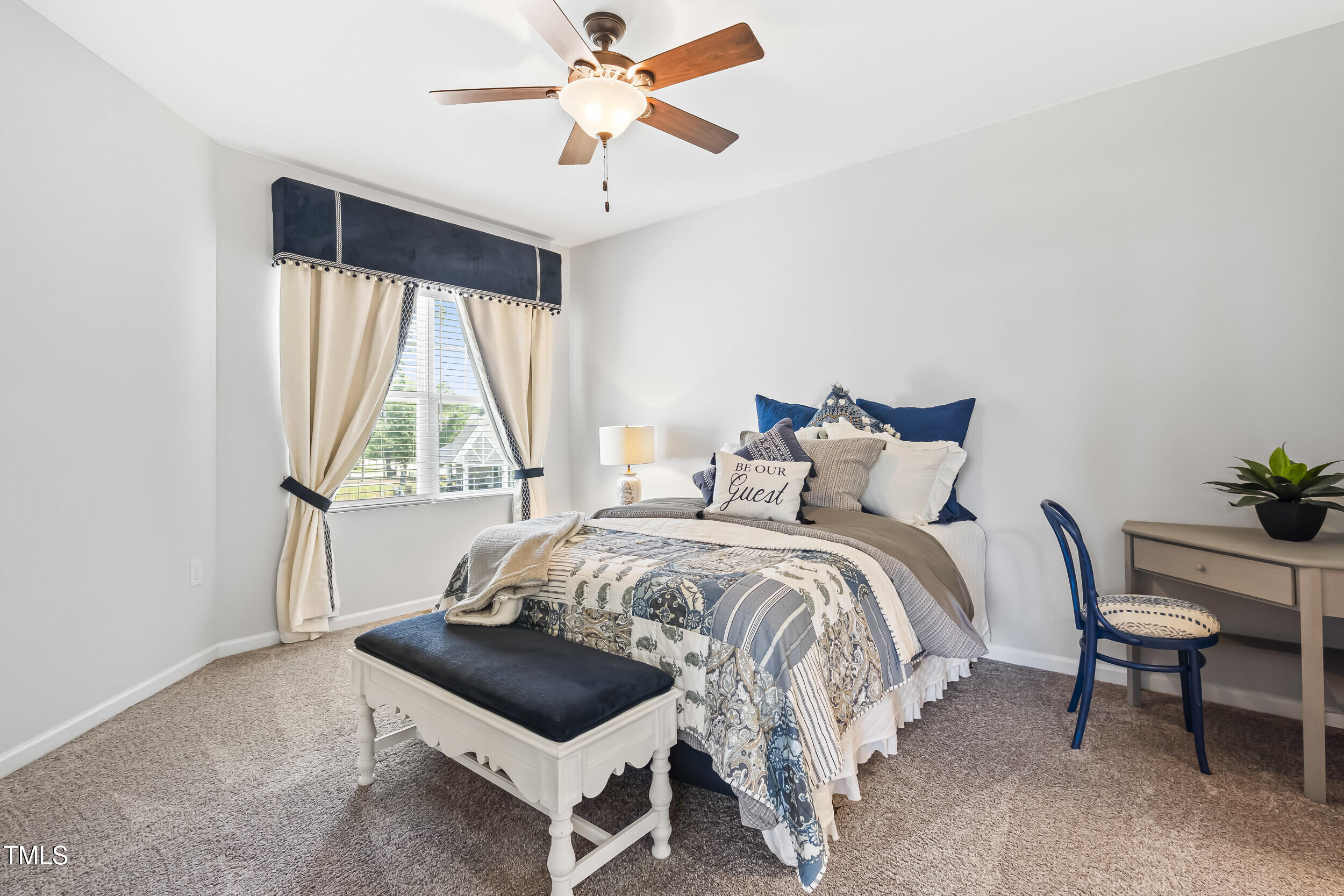 6050 Beale Loop Raleigh, NC 27616 - Photo 24 of 35 a bedroom with a bed and a window