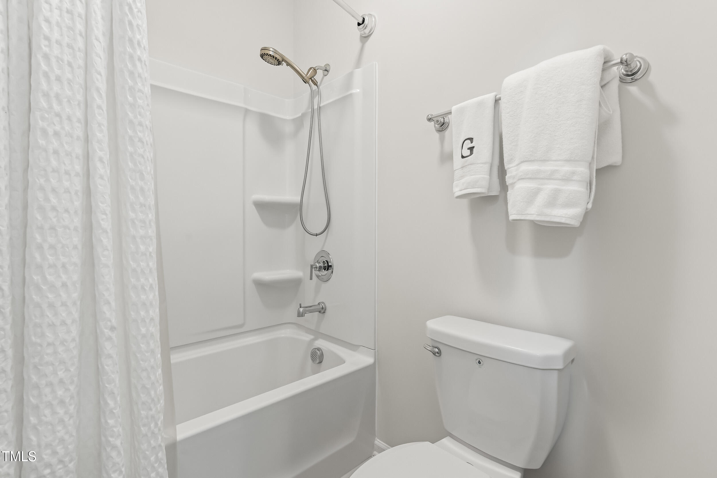 6050 Beale Loop Raleigh, NC 27616 - Photo 27 of 35 a bathroom with a toilet and a shower