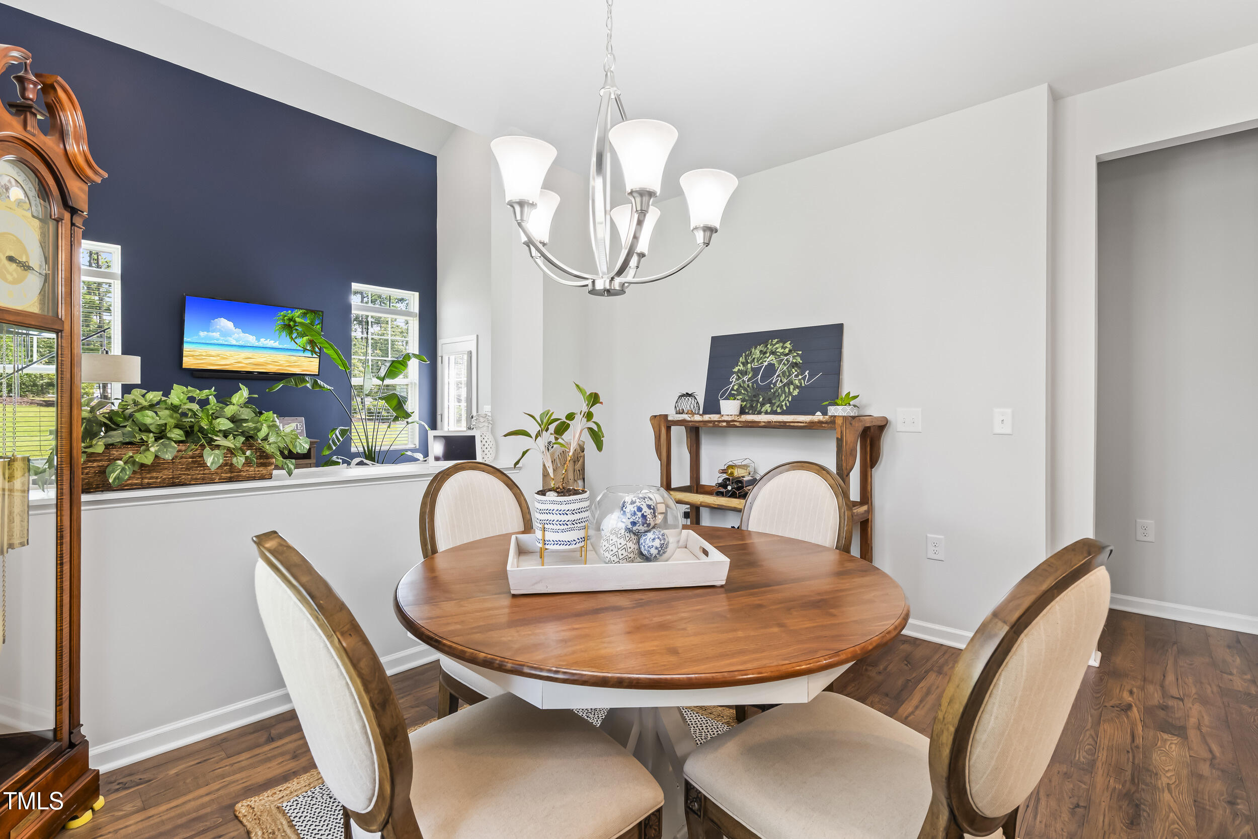 6050 Beale Loop Raleigh, NC 27616 - Photo 9 of 35 a view of a dining room with furniture and wooden floor