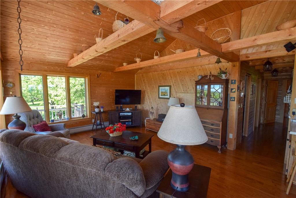 234 Retreat Road Island Falls, ME 04747 - Photo 13 of 35 The living room does offer an area...