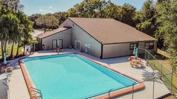 a view of a swimming pool with a lake view