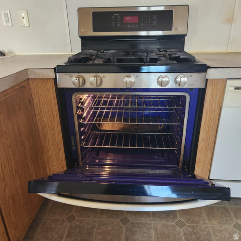 3760 Gold Ridge Drive, Unit 82 Magna, UT 84044 - Photo 13 of 29 Stainless steel range with visible oven interior, gas cooktop, and control panel