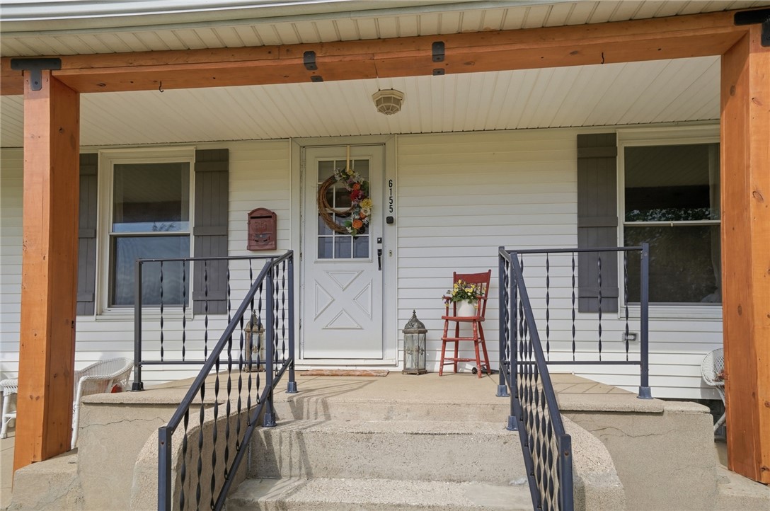 6155 North Union Road Clayton, OH 45315 - Photo 10 of 59 This inviting porch offers a warm welcome with sturdy railings and charming wood accents.