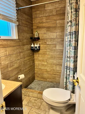 a bathroom with a toilet and a sink