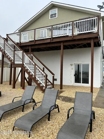 a view of a house with wooden deck