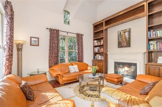 a bedroom with a bed and a fireplace