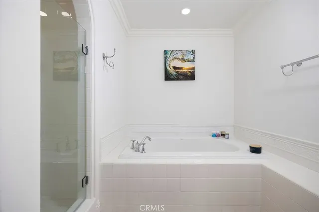 a bathroom with a bathtub and shower