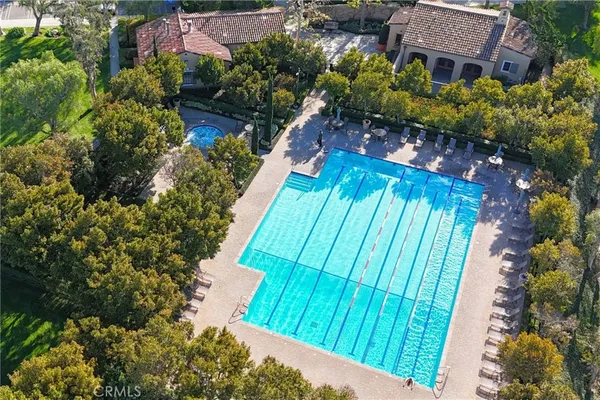 a view of a swimming pool with sitting area