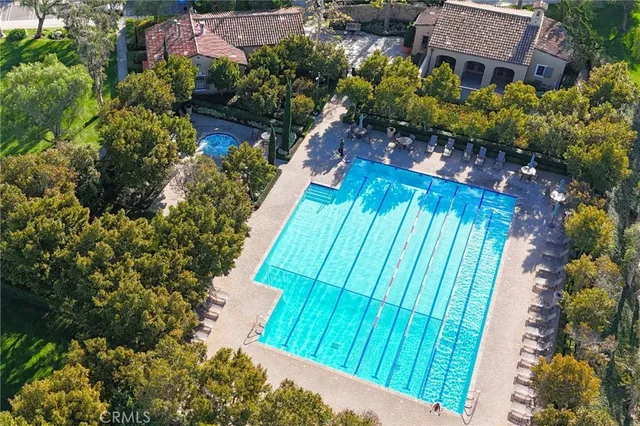 a view of a swimming pool with sitting area