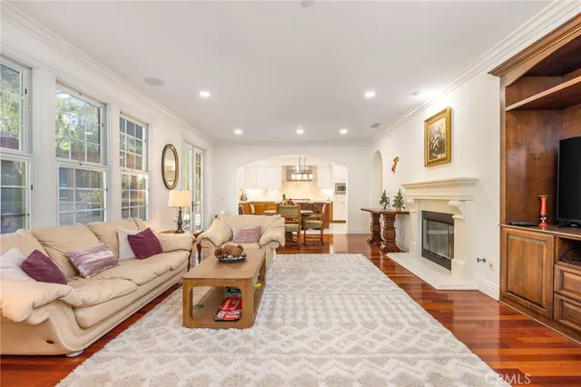 a living room with furniture fireplace and flat screen tv