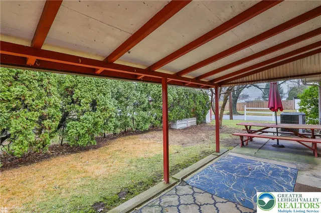a view of entryway with stairs and chandelier fan