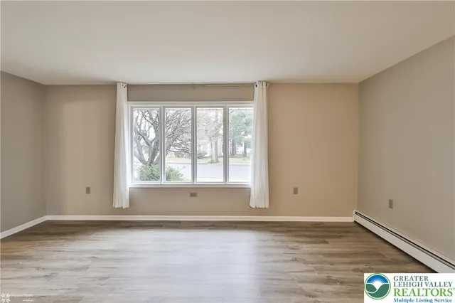 a view of a chandelier in a room with a window
