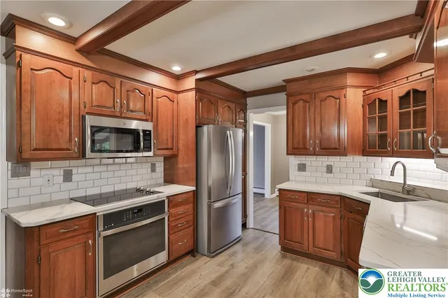 a kitchen with a sink and a window