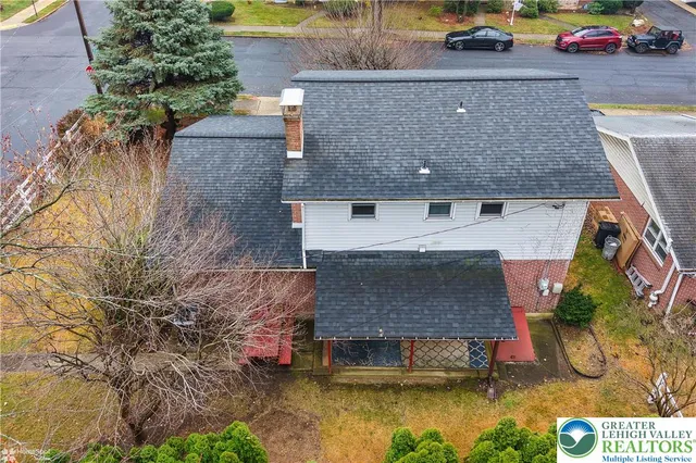 an aerial view of a house with swimming pool