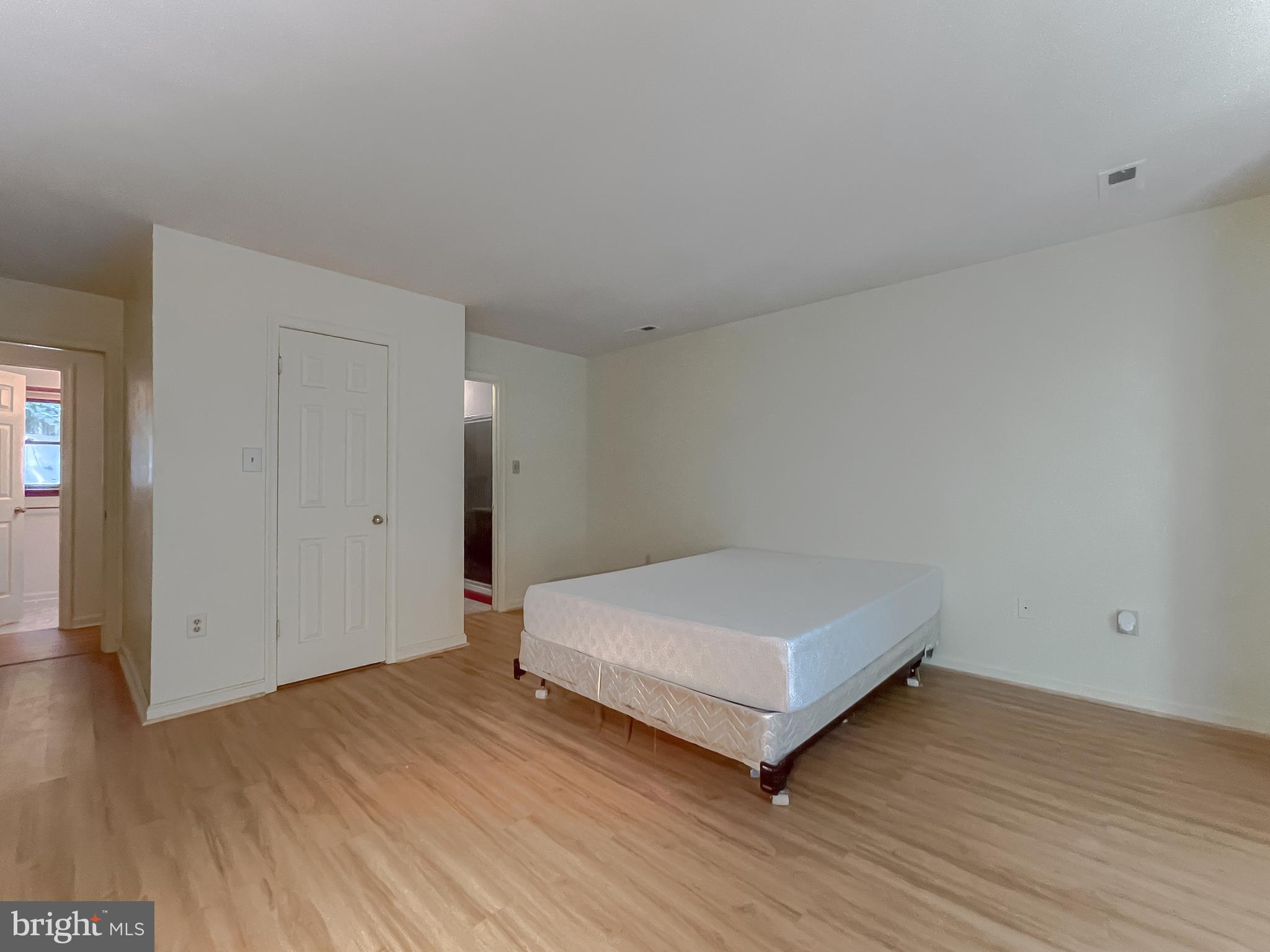 960 Bowie Shop Road Huntingtown, MD 20639 - Photo 46 of 69 a bedroom with a bed and wooden floor