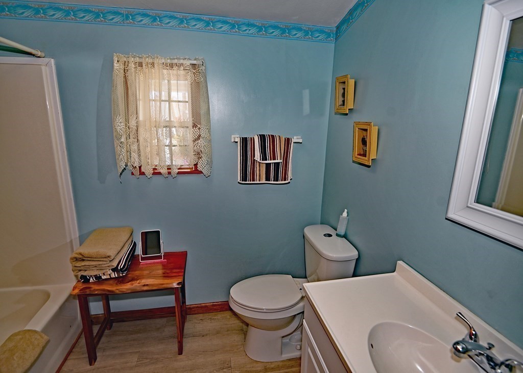 71 Timber Lane Wareham, MA 02571 - Photo 18 of 22 a bathroom with a toilet a sink and a window