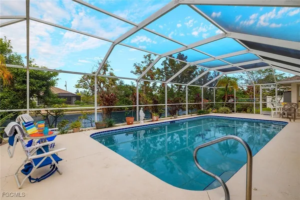 a view of a swimming pool with a patio