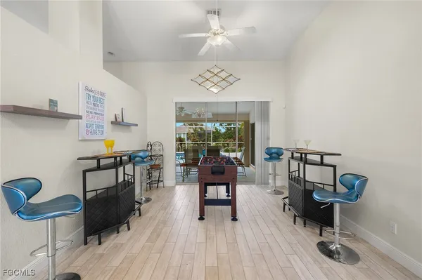 a bedroom with furniture and a chandelier