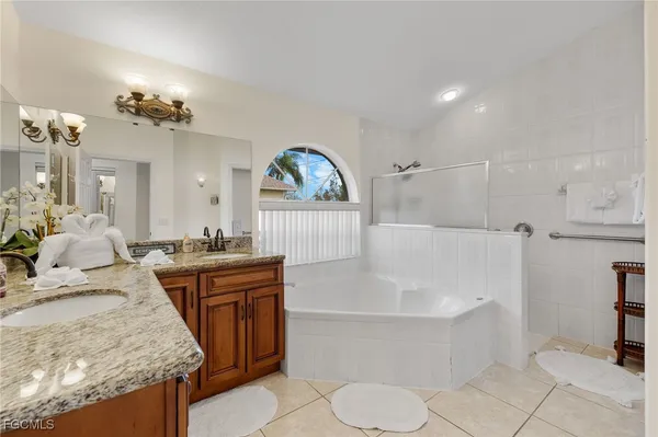 a living room with furniture and a view of kitchen