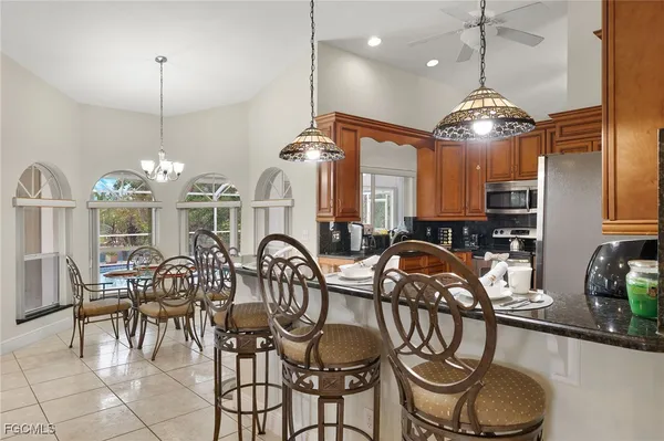 an aerial view of multiple houses with yard
