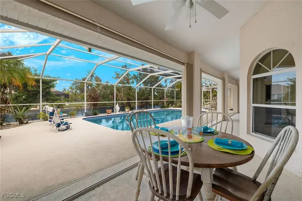 a living room with fireplace furniture and a flat screen tv