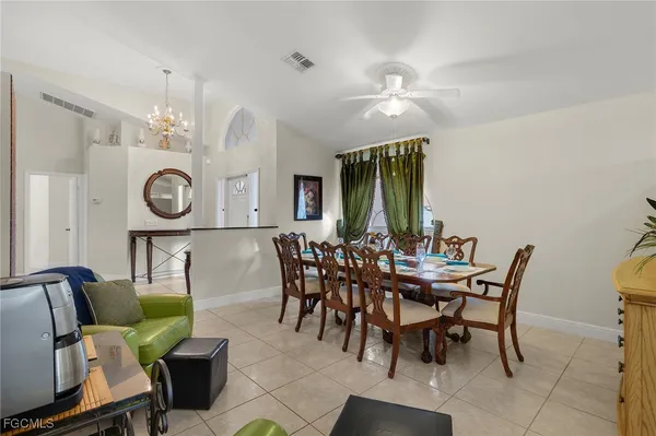 a view of a swimming pool with a outdoor seating