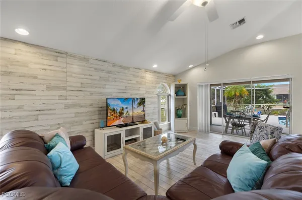 a kitchen with stainless steel appliances granite countertop a refrigerator and sink