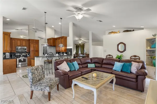 a kitchen with stainless steel appliances granite countertop a stove and a refrigerator