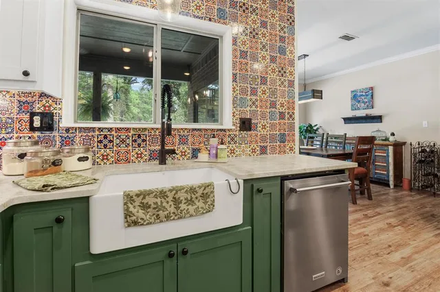 a kitchen with a sink and a wooden cabinets
