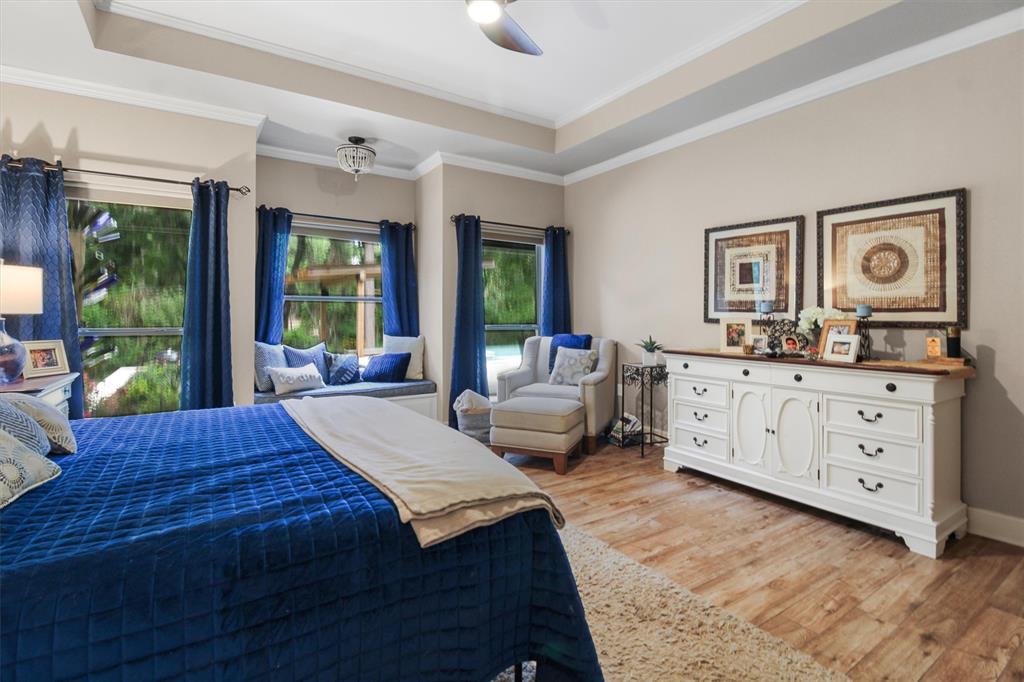 18551 Lazy Lane Flint, TX 75762 - Photo 21 of 39 a bed room with a bed couch and a window