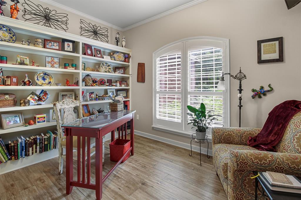 18551 Lazy Lane Flint, TX 75762 - Photo 26 of 39 a living room with furniture and a book shelf