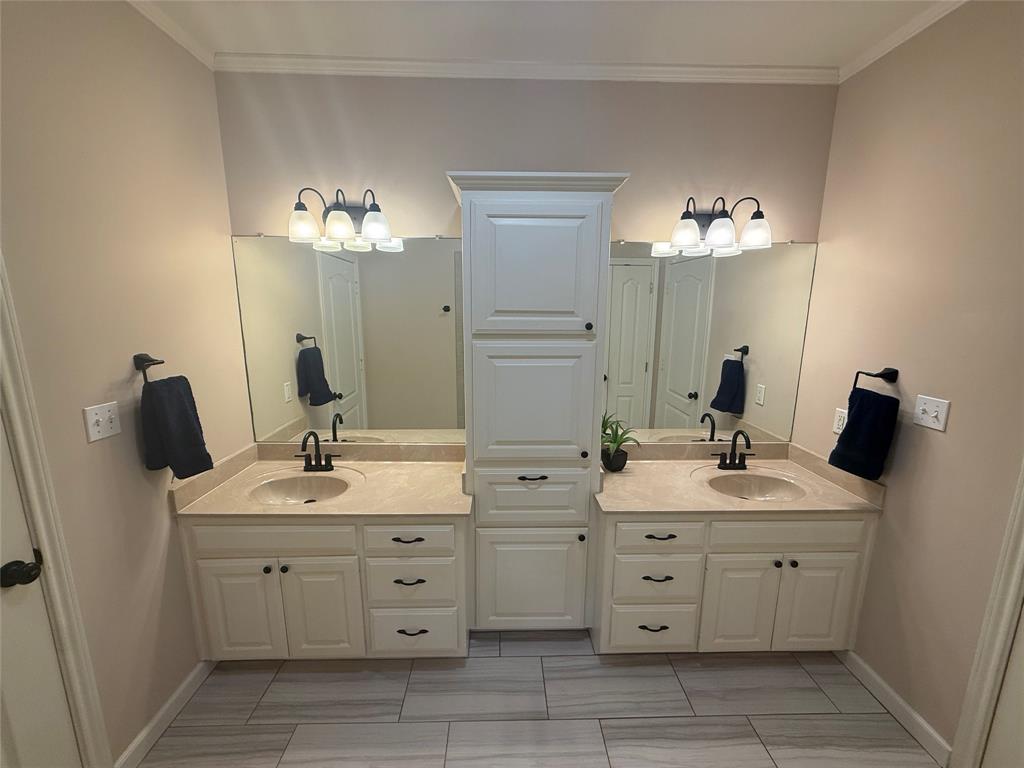18551 Lazy Lane Flint, TX 75762 - Photo 29 of 39 a bathroom with a double vanity sink and mirror