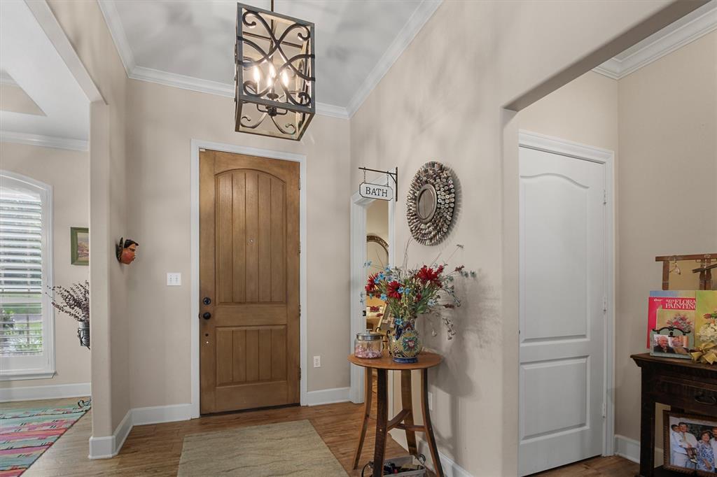 18551 Lazy Lane Flint, TX 75762 - Photo 3 of 39 a view of entryway with wooden floor