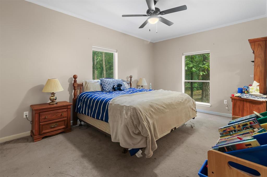 18551 Lazy Lane Flint, TX 75762 - Photo 31 of 39 a bed room with a bed and a window