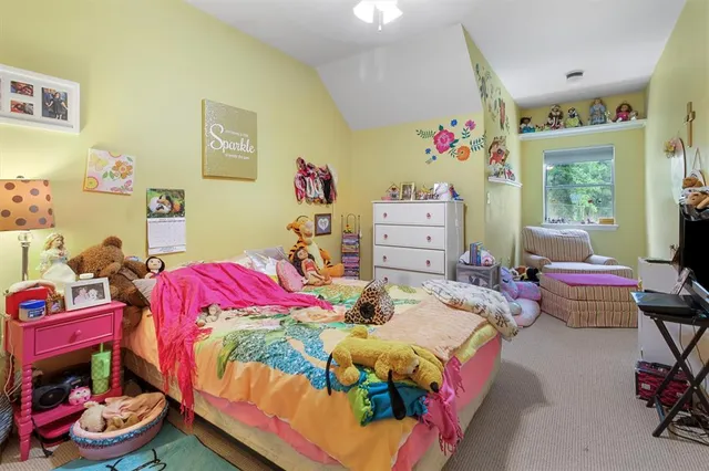 a bedroom with a bed and furniture