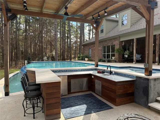 a view of a chairs and table in a patio