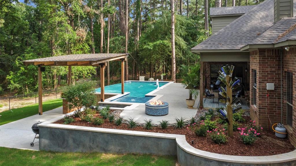 18551 Lazy Lane Flint, TX 75762 - Photo 39 of 39 a view of a house with backyard sitting area and garden