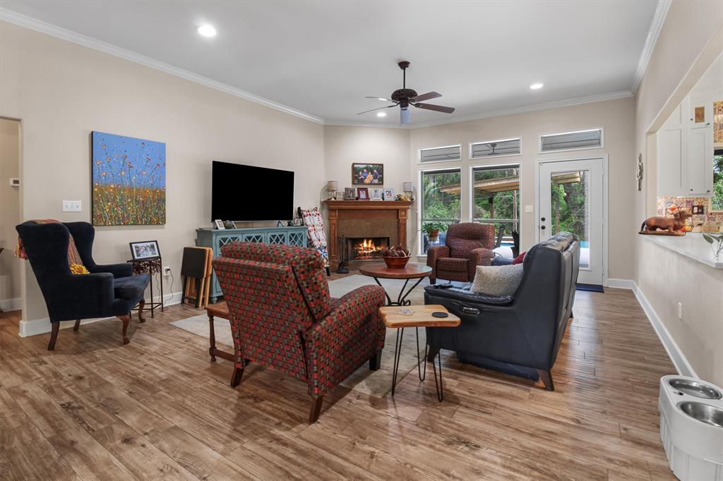 18551 Lazy Lane Flint, TX 75762 - Photo 8 of 39 a living room with furniture a flat screen tv and a fireplace