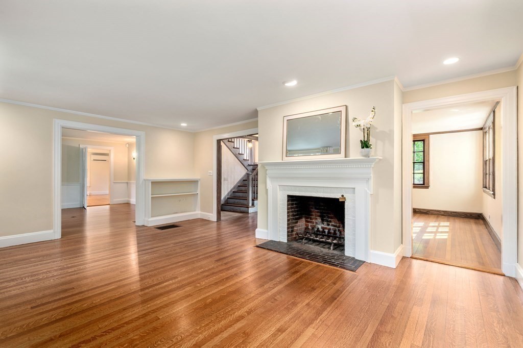 34 Bradford Road Wellesley, MA 02481 - Photo 7 of 35 a view of a livingroom with wooden floor and a fireplace