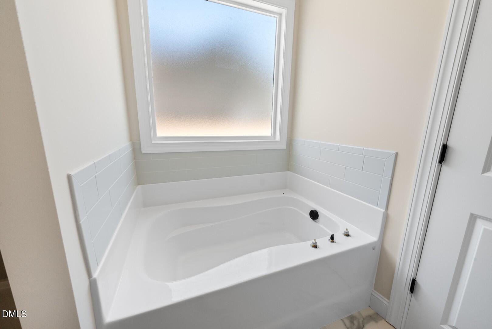 2251 Peachtree Hills Road Spring Hope, NC 27882 - Photo 23 of 46 a white bath tub sitting next to a window