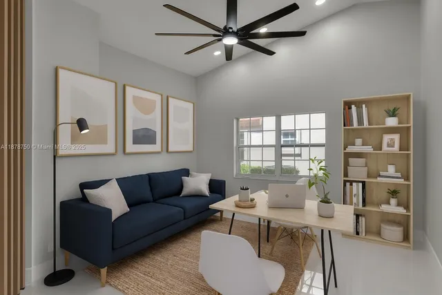 a bedroom with a bed a couch and a window