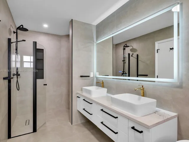 a view of a lake with a big yard and large trees