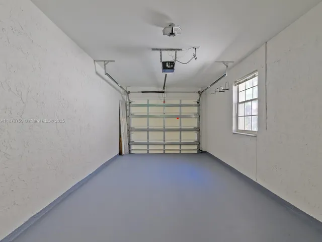 a view of an house with backyard space and balcony